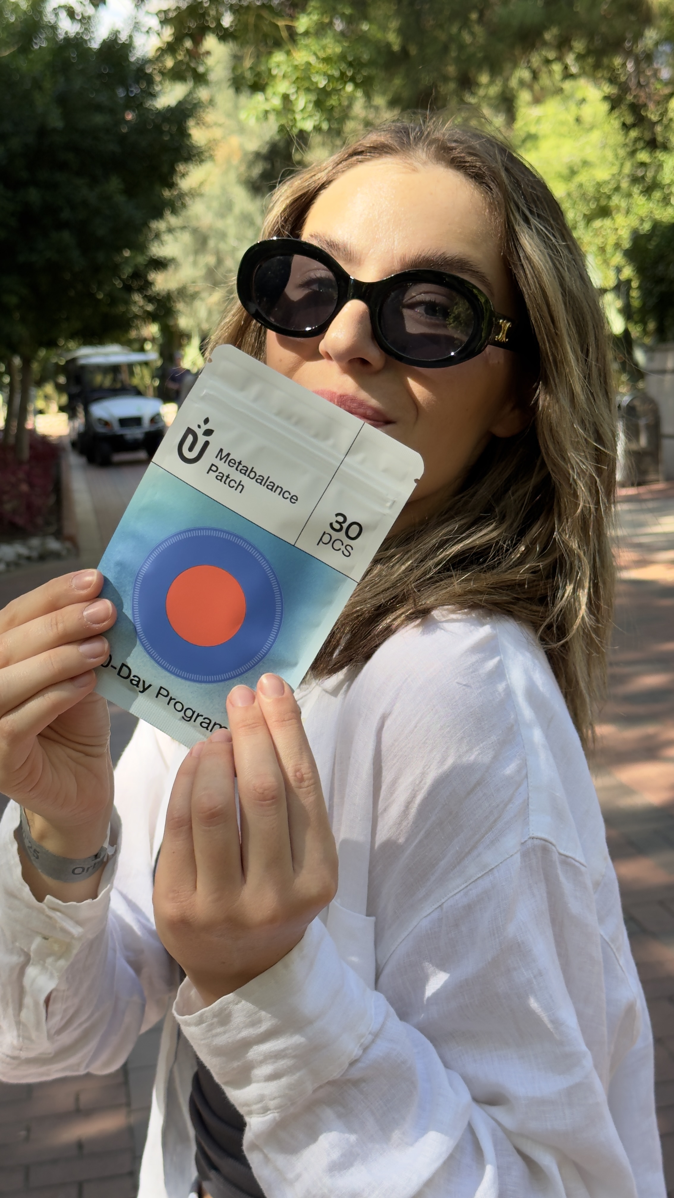 Woman holding Purisaki Berberine Patch 30-day program package
